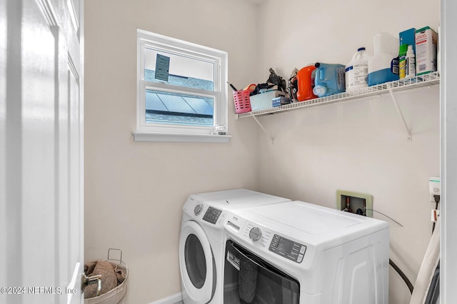 laundry area with independent washer and dryer