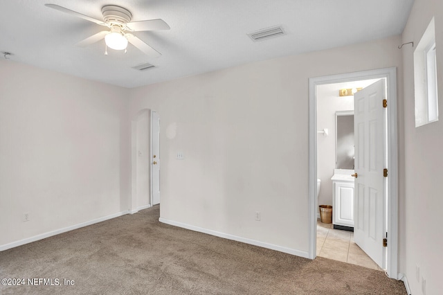 unfurnished bedroom featuring ceiling fan and light colored carpet