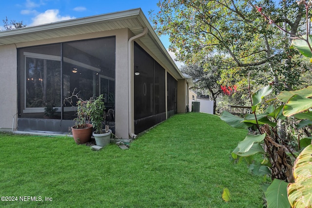 view of yard with a sunroom