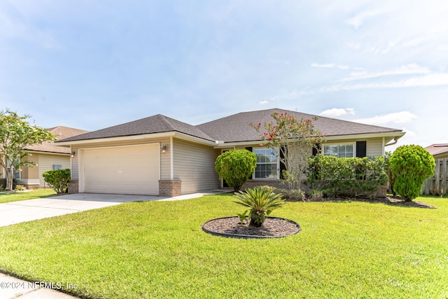 single story home with a garage and a front lawn