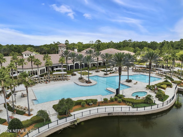 view of pool with a water view