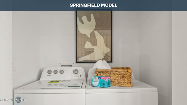 clothes washing area featuring separate washer and dryer