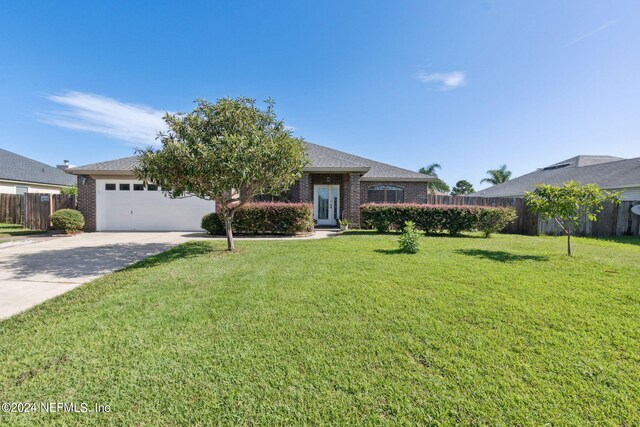 ranch-style home featuring a front yard