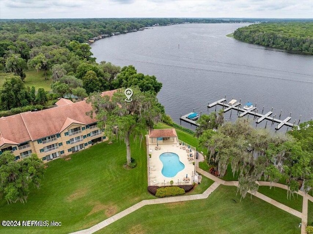 bird's eye view with a water view and a wooded view