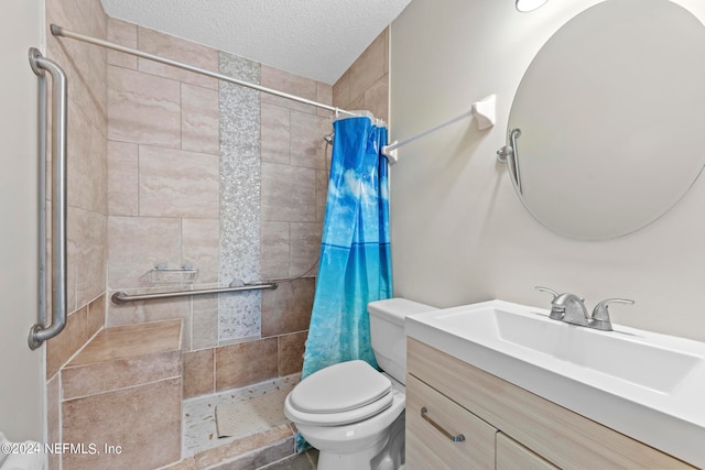 bathroom featuring vanity, toilet, a textured ceiling, and a shower with shower curtain