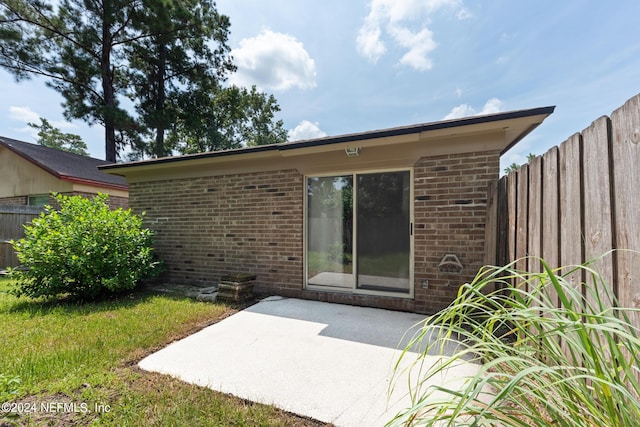 rear view of house featuring a patio area