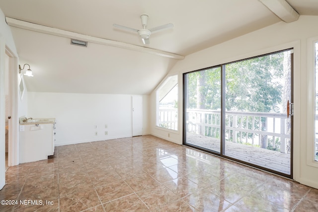 interior space with lofted ceiling with beams, sink, ceiling fan, and tile patterned floors