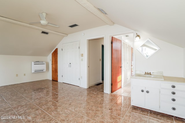 bonus room featuring sink, light tile patterned floors, ceiling fan, and vaulted ceiling