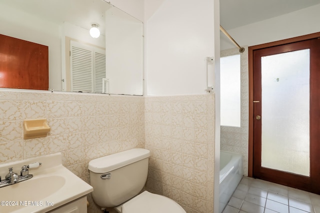 full bathroom with tile walls, tile patterned floors, toilet, and vanity