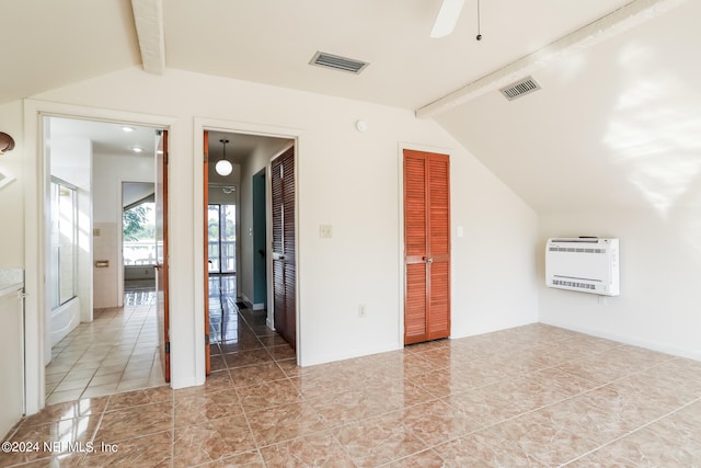 tiled spare room featuring lofted ceiling with beams and ceiling fan