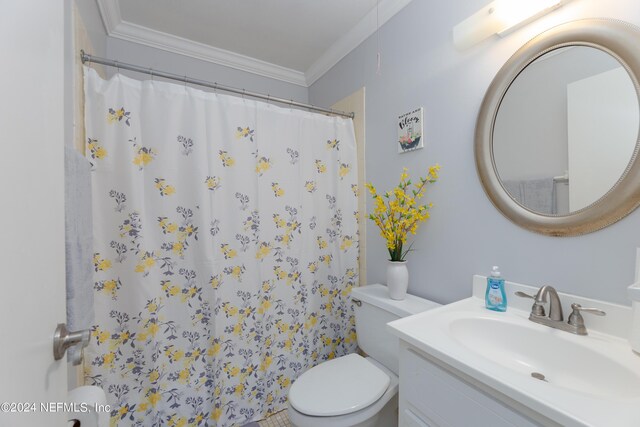 bathroom featuring ornamental molding, toilet, a shower with shower curtain, and vanity