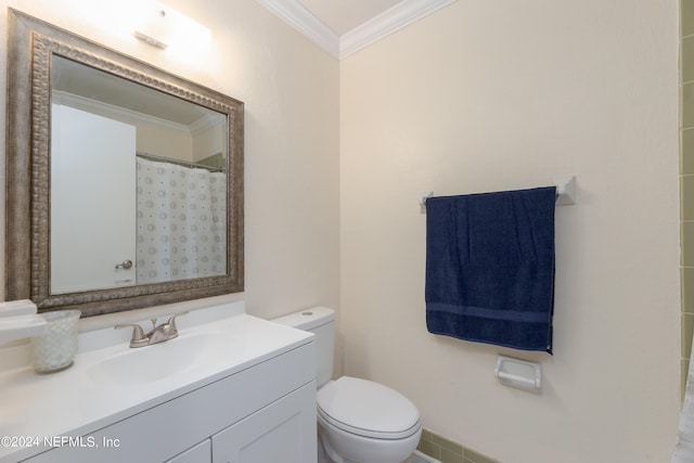 bathroom featuring a shower with curtain, ornamental molding, toilet, and vanity