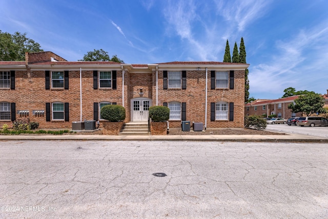 view of front facade featuring central AC unit and french doors