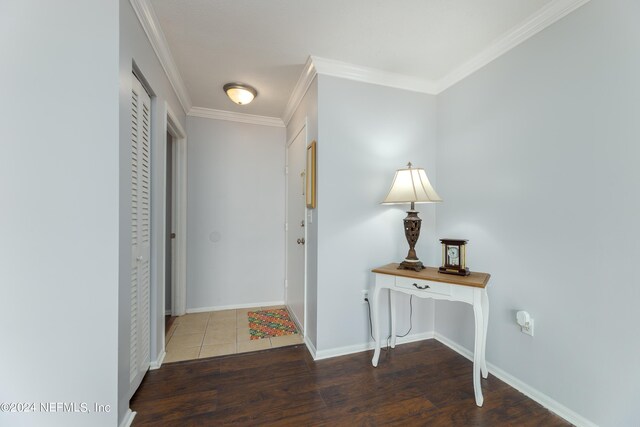 interior space featuring ornamental molding and hardwood / wood-style flooring