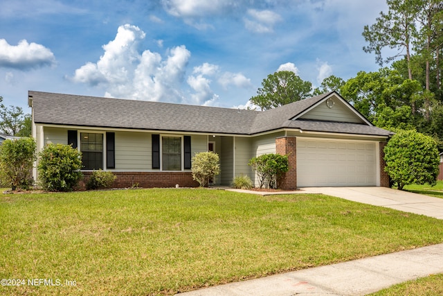 single story home with a garage and a front lawn