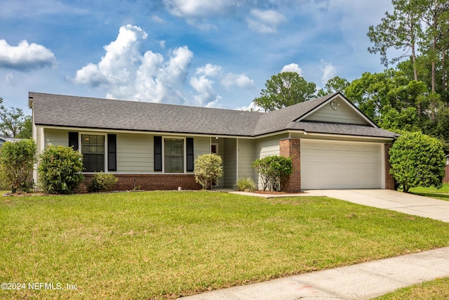 ranch-style home featuring a garage and a front lawn