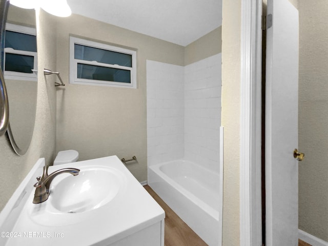 full bathroom with toilet, vanity, and shower / bathtub combination