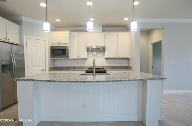 kitchen with white cabinetry, hanging light fixtures, an island with sink, and appliances with stainless steel finishes