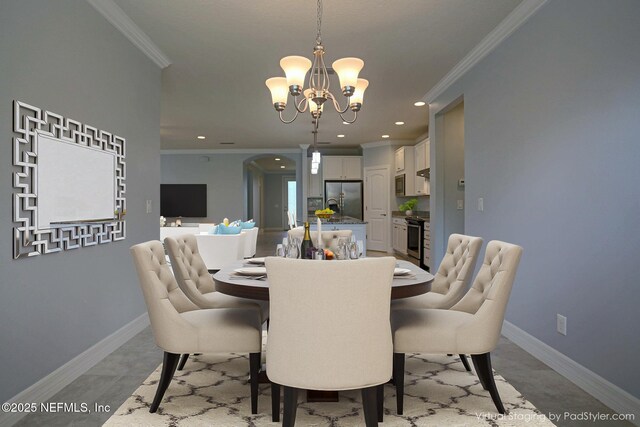 dining space featuring crown molding, a chandelier, and light tile patterned flooring