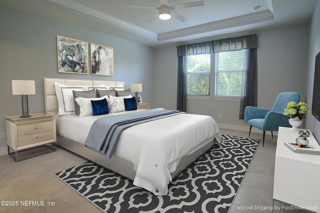 bedroom featuring ornamental molding, ceiling fan, and a tray ceiling