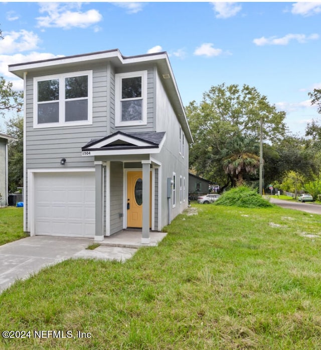 view of front facade featuring a front yard and a garage