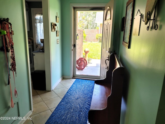 entryway featuring light tile patterned floors