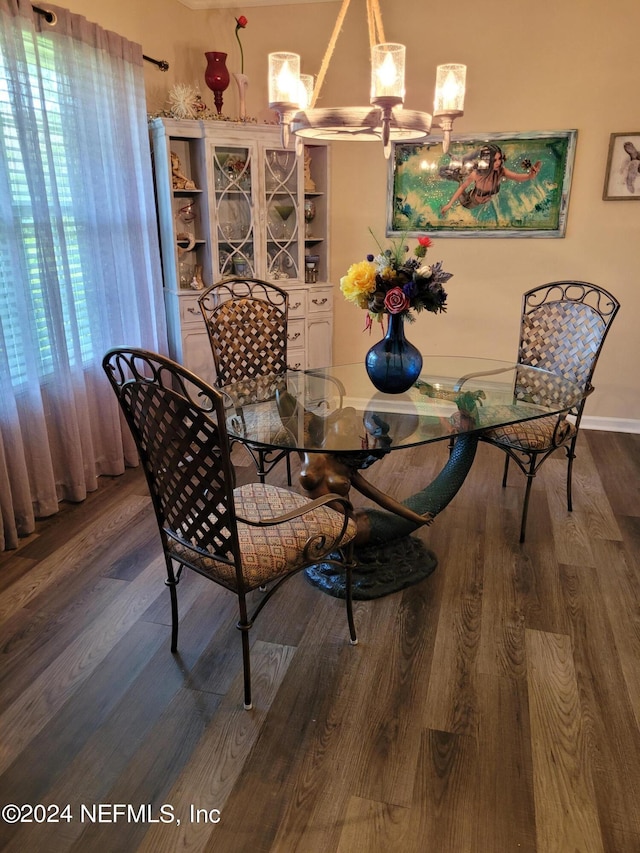 dining room with a chandelier and hardwood / wood-style floors