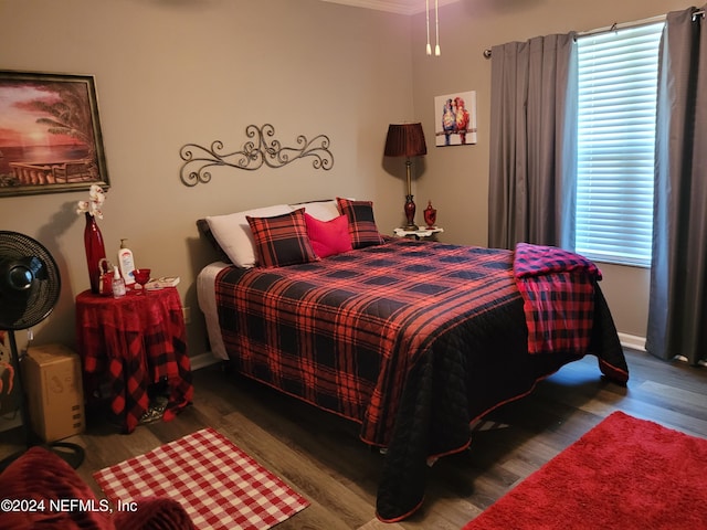 bedroom with hardwood / wood-style floors