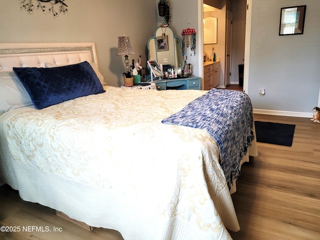 9252 San Jose Blvd Unit 4301, Jacksonville, FL 32257 - bedroom with baseboards, wood finished floors, and ensuite bathroom