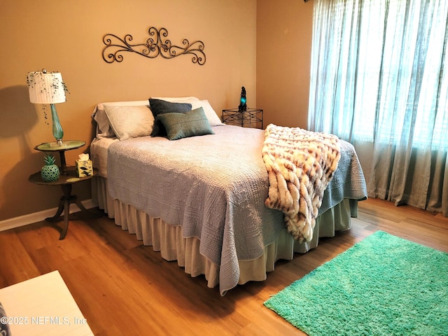 9252 San Jose Blvd Unit 4301, Jacksonville, FL 32257 - bedroom with baseboards and wood finished floors