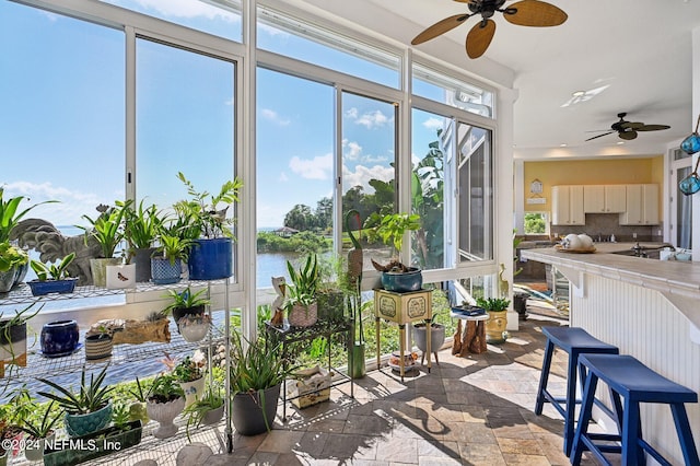 sunroom with a water view