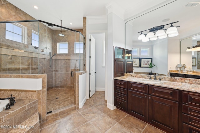 full bathroom with a stall shower, baseboards, visible vents, and vanity