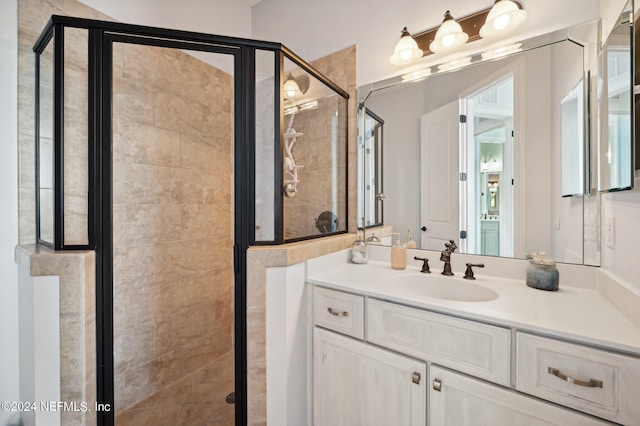 full bath featuring a shower stall and vanity