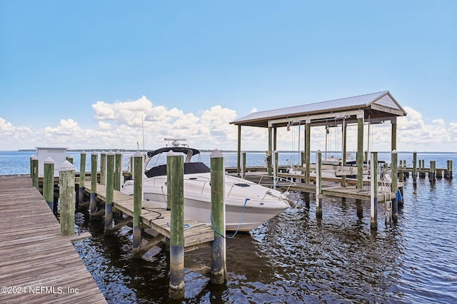 dock area featuring a water view and boat lift