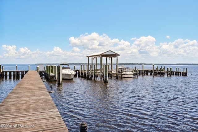 view of dock with a water view and boat lift