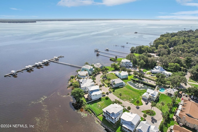 birds eye view of property with a water view and a residential view