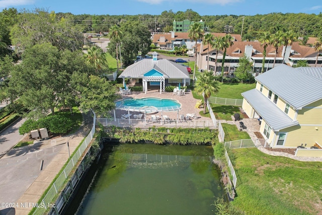 birds eye view of property featuring a water view and a residential view