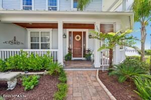 property entrance featuring covered porch