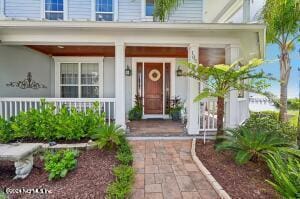 entrance to property with a porch