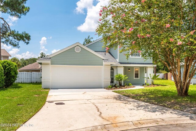 front of property featuring a garage and a front yard