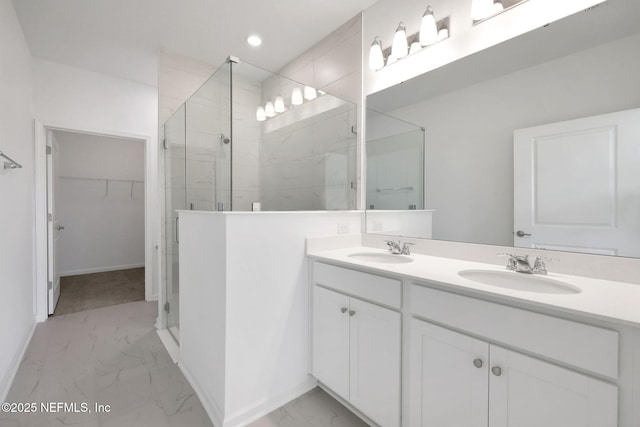 bathroom featuring vanity and a shower with shower door