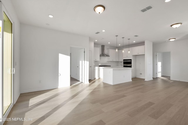 unfurnished living room with light wood-type flooring