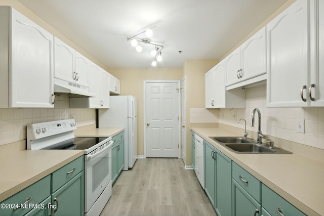 kitchen featuring white appliances, white cabinets, sink, light hardwood / wood-style floors, and rail lighting