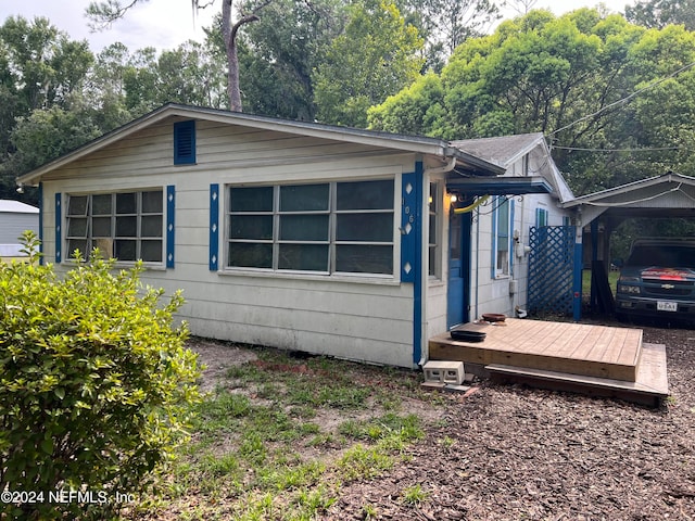 view of home's exterior featuring a deck