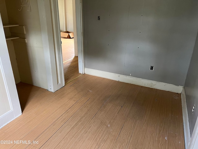 unfurnished room featuring light hardwood / wood-style floors