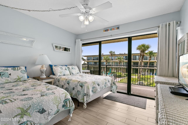 bedroom with access to exterior, light wood finished floors, and a ceiling fan