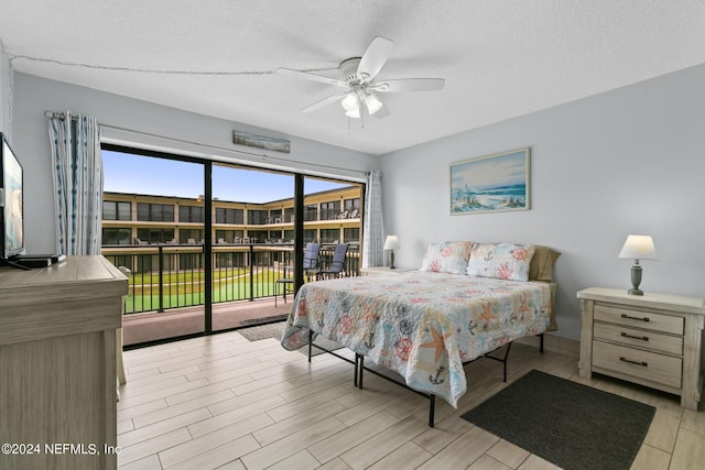 bedroom with access to exterior, light wood-style floors, a textured ceiling, and a ceiling fan