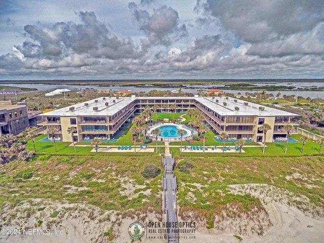 birds eye view of property with a water view