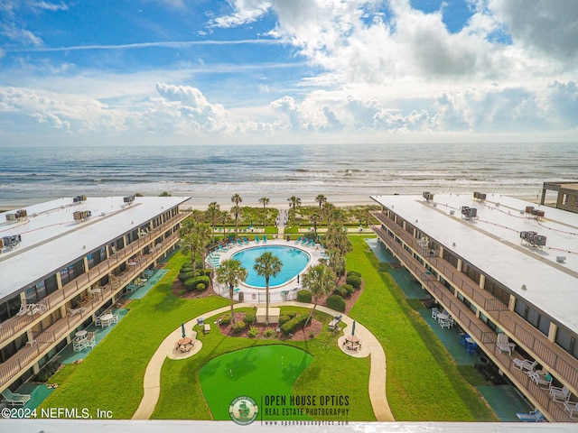 birds eye view of property with a water view