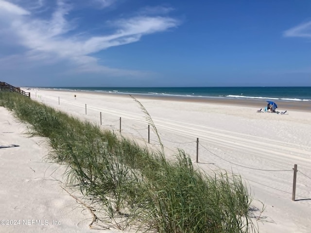 property view of water featuring a beach view